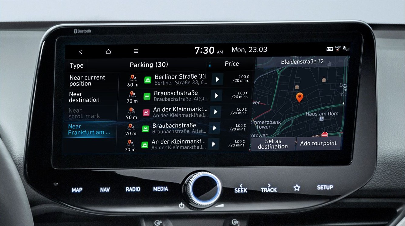 Close-up of a Hyundai touchscreen showing a list of available parking spots.